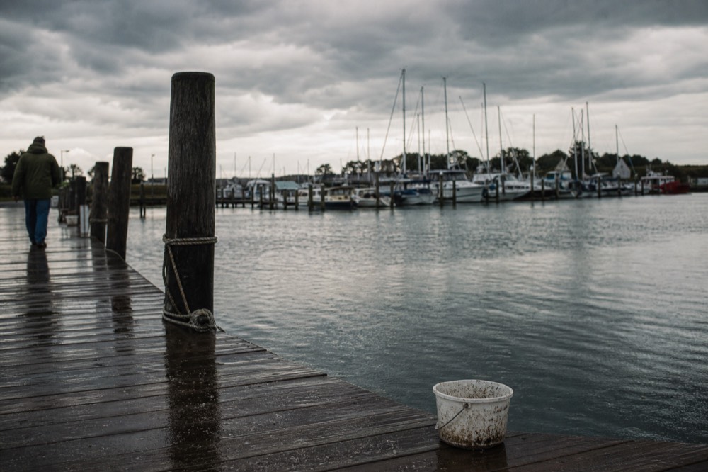 Dark clouds over the Key West waterfront, no text, no logos, no people