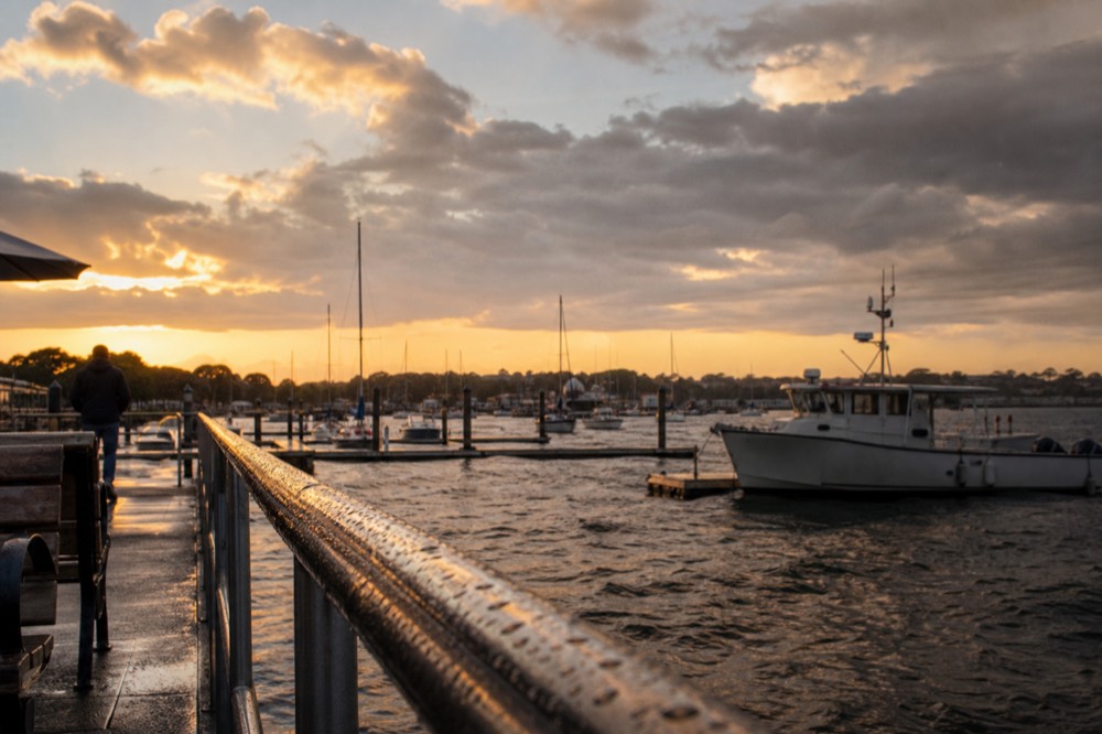Sunset over Key West harbor with boats, no text, no logos, no people