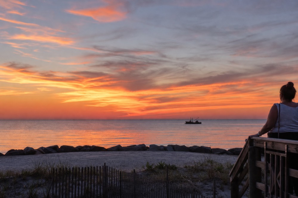 A wide tropical sunset sky over the flat horizon of the sea near Key West, no text, no logos, no people